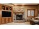 Warm and inviting living room features a stone fireplace and natural light at 553 Bolderwood Ln, Carmel, IN 46032