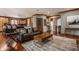Expansive living room with hardwood floors, a fireplace, and an open concept design at 553 Bolderwood Ln, Carmel, IN 46032