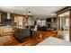 Open concept floor plan with kitchen island and living room fireplace at 553 Bolderwood Ln, Carmel, IN 46032
