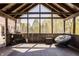 Spacious screened-in porch with comfortable seating and a relaxing atmosphere with an outdoor BBQ at 553 Bolderwood Ln, Carmel, IN 46032