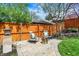 Cozy backyard patio with outdoor seating, landscaping, and a modern fire pit at 5611 N Delaware St, Indianapolis, IN 46220