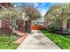 Traditional brick home with a long driveway, beautiful trees, and meticulous landscaping at 5611 N Delaware St, Indianapolis, IN 46220