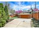 Detached two-car garage surrounded by a well maintained yard and mature trees at 5611 N Delaware St, Indianapolis, IN 46220