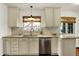 Bright kitchen featuring granite countertops, stainless steel appliances, and white cabinets at 5611 N Delaware St, Indianapolis, IN 46220