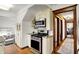 Well-equipped kitchen with stainless steel appliances, custom cabinetry, and hardwood floors at 5611 N Delaware St, Indianapolis, IN 46220