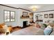 Inviting living room features a fireplace, hardwood floors, and ample natural light at 5611 N Delaware St, Indianapolis, IN 46220