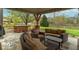 Relaxing backyard patio with a hot tub and outdoor seating for entertaining at 5895 Sugar Pine Dr, Avon, IN 46123