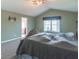 Primary bedroom with a vaulted ceiling, window, and ensuite bathroom at 5895 Sugar Pine Dr, Avon, IN 46123