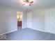 Bedroom boasts neutral paint, carpeted floors, ceiling fan, and an ensuite bathroom at 5895 Sugar Pine Dr, Avon, IN 46123