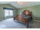 Cozy bedroom featuring a vaulted ceiling and a large window for ample natural light at 5895 Sugar Pine Dr, Avon, IN 46123