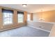 Bright, carpeted bonus room with natural light from three large windows at 5895 Sugar Pine Dr, Avon, IN 46123