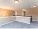 Spacious carpeted bonus room with a view of the downstairs area at 5895 Sugar Pine Dr, Avon, IN 46123