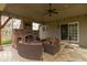 Cozy covered patio featuring a brick fireplace and comfortable seating area at 5895 Sugar Pine Dr, Avon, IN 46123