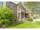 Attractive two-story brick home with a covered front porch and well-maintained landscaping at 5895 Sugar Pine Dr, Avon, IN 46123