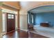 Welcoming foyer featuring a dark wood front door and an open view into the living room at 5895 Sugar Pine Dr, Avon, IN 46123
