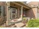 Inviting front porch with a comfortable bench and tasteful landscaping at 5895 Sugar Pine Dr, Avon, IN 46123