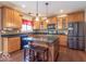 Well-equipped kitchen with granite countertops, an island, and stainless steel appliances at 5895 Sugar Pine Dr, Avon, IN 46123