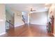 Spacious living room featuring hardwood floors, stairs, and fireplace at 5895 Sugar Pine Dr, Avon, IN 46123
