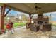Covered patio with brick fireplace, ceiling fan, and outdoor grill; great for entertaining at 5895 Sugar Pine Dr, Avon, IN 46123