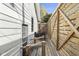 Long view of backyard patio with wooden fencing and outdoor chairs at 617 Carlyle Pl, Indianapolis, IN 46201