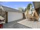 Backyard patio with outdoor furniture, wooden fence, and lush greenery at 617 Carlyle Pl, Indianapolis, IN 46201