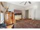 Bedroom featuring hardwood floors, television, wood dressers and ceiling fan at 617 Carlyle Pl, Indianapolis, IN 46201
