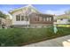 Charming home with well-maintained lawn, brick enclosed porch and tasteful landscaping at 617 Carlyle Pl, Indianapolis, IN 46201