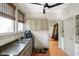 Well-lit kitchen featuring stainless sink, earth-tone cabinetry, and view to dining area at 617 Carlyle Pl, Indianapolis, IN 46201