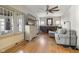 Bright living room features hardwood floors, neutral paint, and a brick fireplace at 617 Carlyle Pl, Indianapolis, IN 46201