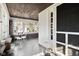 Charming sunroom featuring tile floor, neutral paint, and bright windows at 617 Carlyle Pl, Indianapolis, IN 46201