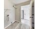 Laundry Room including vinyl floor and wire rack shelving and doorway to the kitchen at 6218 Churchman Way, Indianapolis, IN 46237