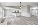 Spacious living room with lots of light featuring an open floor plan and modern flooring at 6218 Churchman Way, Indianapolis, IN 46237
