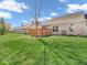 Lush backyard with green grass and privacy fence at 6502 E Walton Dr, Camby, IN 46113
