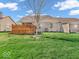 Spacious backyard featuring a lush lawn and a charming wood fence at 6502 E Walton Dr, Camby, IN 46113