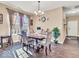 Inviting dining room features hardwood floors and an elegant chandelier at 6502 E Walton Dr, Camby, IN 46113