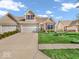Attractive brick townhome with a well-maintained lawn and a convenient two-car garage at 6502 E Walton Dr, Camby, IN 46113