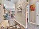 Hallway showcasing neutral walls, decor, and access to various rooms with carpet and hard surface flooring at 6502 E Walton Dr, Camby, IN 46113