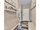 Entryway featuring neutral walls, decor, and access to various rooms with carpet and hard surface flooring at 6502 E Walton Dr, Camby, IN 46113