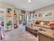 Comfortable living room with a sliding glass door to the outside patio at 6502 E Walton Dr, Camby, IN 46113