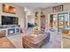 Open-concept living room with fireplace and cozy seating at 6502 E Walton Dr, Camby, IN 46113