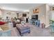 Inviting living room showcasing sofas, fireplace, and open layout to kitchen and dining areas at 6502 E Walton Dr, Camby, IN 46113