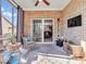 Relaxing sunroom with ceiling fan and brick walls at 6502 E Walton Dr, Camby, IN 46113