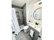 Modern bathroom with a tiled shower, gray vanity, and contemporary fixtures at 653 Southridge Ct, Westfield, IN 46074