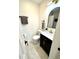 Cozy half-bath with modern vanity, mirror, and neutral color scheme at 653 Southridge Ct, Westfield, IN 46074