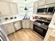 Clean kitchen with stainless steel appliances, ample countertop space, and natural light at 653 Southridge Ct, Westfield, IN 46074