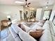 Spacious living room featuring skylight, hardwood floors, and neutral-toned sectional sofa at 653 Southridge Ct, Westfield, IN 46074