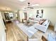 Open-concept living room with a skylight, wood floors, and modern furnishings at 653 Southridge Ct, Westfield, IN 46074