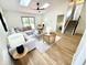 Bright living room with a skylight, cozy seating, and stylish decor at 653 Southridge Ct, Westfield, IN 46074
