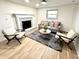 Cozy living room featuring a fireplace, comfortable seating, and natural light at 653 Southridge Ct, Westfield, IN 46074