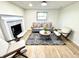 Cozy living room featuring a fireplace, comfortable seating, and natural light at 653 Southridge Ct, Westfield, IN 46074